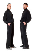 Two people wearing matching black outfits on a white background